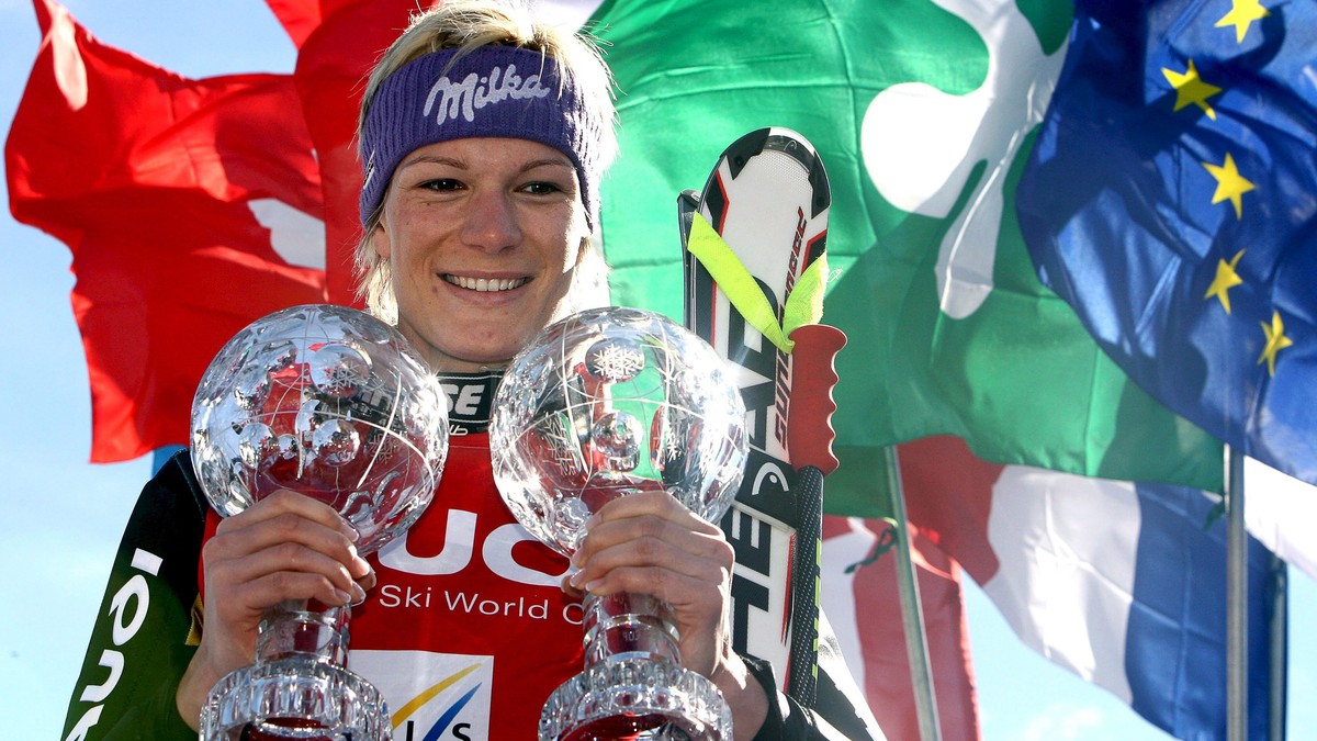 epa04133481 (FILE) A file picture dated 13 March 2008 shows Germany's Maria Riesch posing with her crystal globe trophies on the podium after winning the women's overall Super-G and the Supe ...