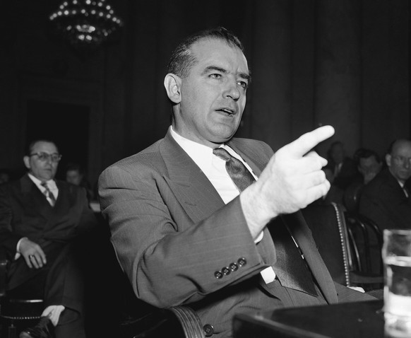 In this March 9, 1950 file photo, Sen. Joseph McCarthy, R-Wis., gestures during a Senate subcommittee hearing on McCarthy&#039;s charges of communist infiltration of the U.S. State Department. Preside ...