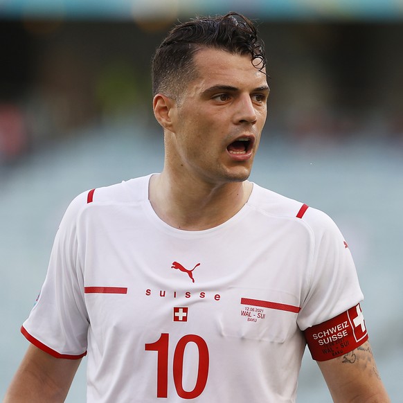 epa09264485 Granit Xhaka of Switzerland reacts during the UEFA EURO 2020 group A preliminary round soccer match between Wales and Switzerland in Baku, Azerbaijan, 12 June 2021. EPA/Valentin Ogirenko / ...
