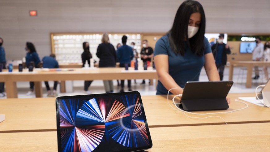 A new iPad Pro is displayed at an Apple Store, Friday, May 21, 2021, in New York. The latest iPad Pros will work on ultrafast 5G wireless networks. (AP Photo/Mark Lennihan)