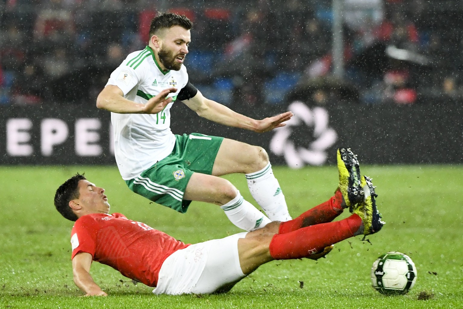 epa06325259 Switzerland&#039;s defender Fabian Schaer (down) fights for the ball with Northern Ireland&#039;s midfielder Stuart Dallas during the 2018 Fifa World Cup play-offs second leg soccer match  ...
