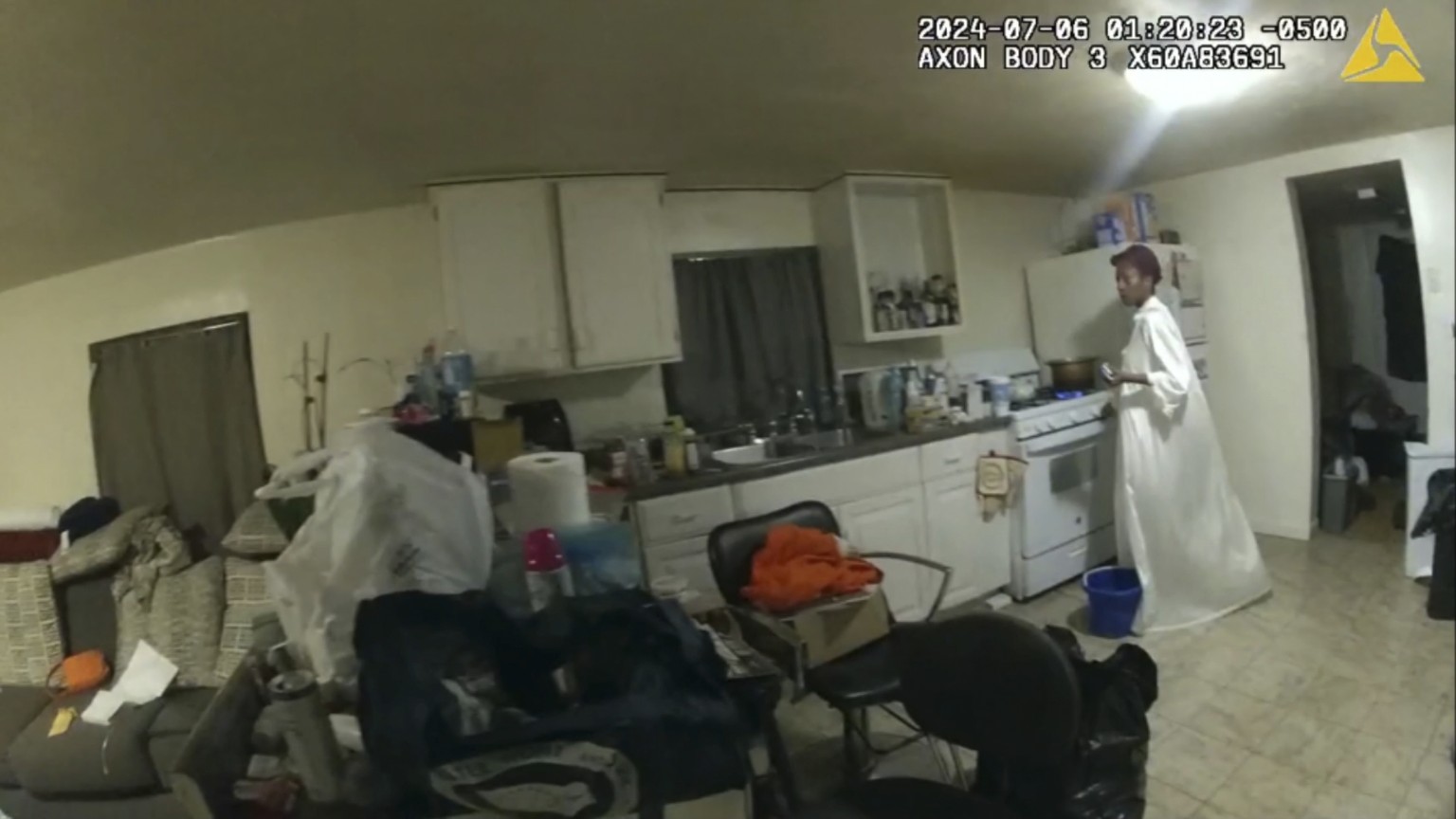 In this image taken from body camera video released by Illinois State Police on Monday, July 22, 2024, Sonya Massey, who called 911 for help, stands near her kitchen stove before being shot in the fac ...