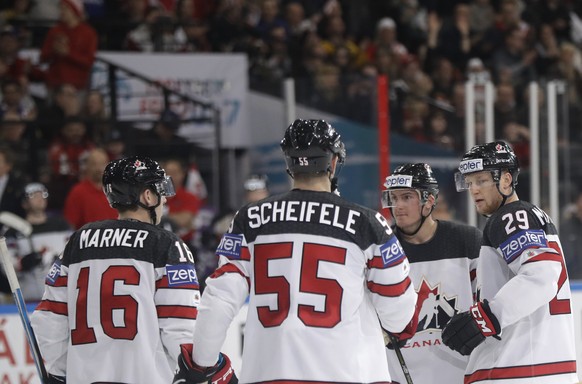 Canada&#039;s Nate Mackinnon, right, with teammates Tyson Barrie, 2nd right, Mark Scheifele, 2nd left, Mitch Marner, left, after scoring a goal during the Ice Hockey World Championships group B match  ...