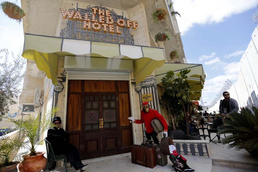 epa05829690 A view of the entrance of British street artist Banksy&#039;s Walled Off Hotel in the West Bank city of Bethlehem, 04 March 2017. The hotel in the Palestinian territories is placed only a  ...