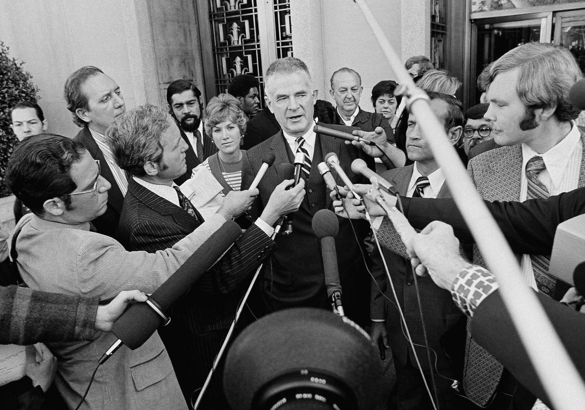 FILE - In this Oct. 19, 1973, file photo special Watergate prosecutor Archibald Cox talks to media outside the U.S. District Court in Washington after ousted White House counsel John W. Dean III plead ...