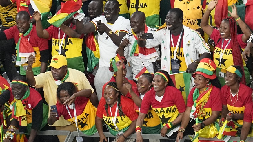 Ghana supporters celebrate after Ghana won the World Cup group H soccer match against South Korea, at the Education City Stadium in Al Rayyan, Qatar, Monday, Nov. 28, 2022. (AP Photo/Ebrahim Noroozi)