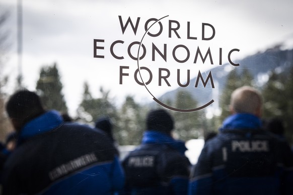 epa10406534 Police officers assemble outside the congress center on the eve of the 52nd annual meeting of the World Economic Forum (WEF) in Davos, Switzerland, 15 January 2023. The meeting brings toge ...