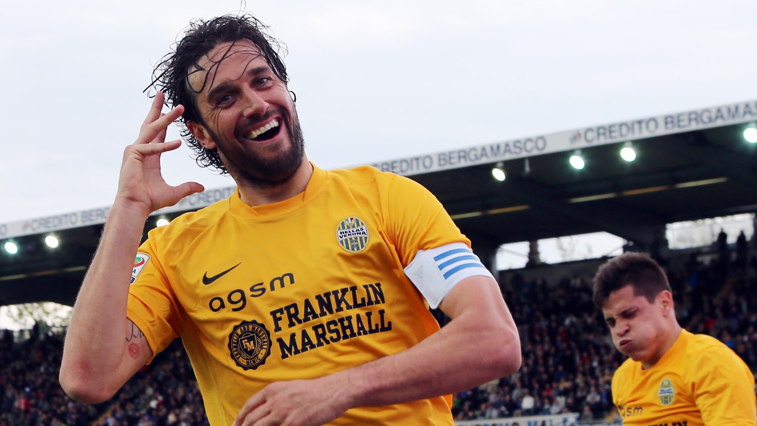 Hellas Verona&#039;s Luca Toni celebrates after scoring during a Serie A soccer match against Atalanta in Bergamo, Italy, Saturday, April 19, 2014. (AP Photo/Felice Calabro&#039;)