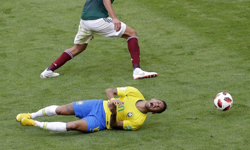 Brazil&#039;s Neymar, bottom, challenges for the ball with Mexico&#039;s Edson Alvarez during the round of 16 match between Brazil and Mexico at the 2018 soccer World Cup in the Samara Arena, in Samar ...