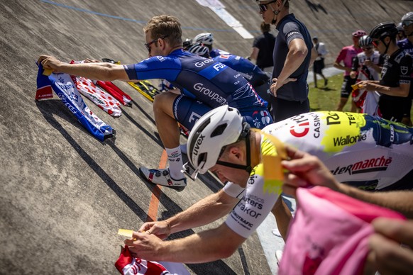 Riders put down a jersey during a mourning celebration to honor deceased racer Gino Maeder of Switzerland on the open racetrack &quot;Offene Rennbahn&quot; in Zurich Oerlikon, Switzerland, on Saturday ...