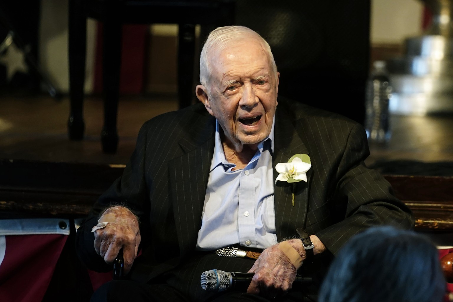 FILE - Former President Jimmy Carter responds as his wife Rosalynn Carter speaks at a reception to celebrate their 75th wedding anniversary, July 10, 2021, in Plains, Georgia.  The Carter Center said Satu…