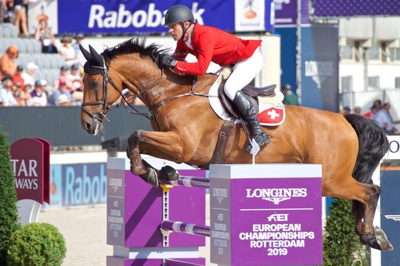 (190824) -- ROTTERDAM, Aug. 24, 2019 (Xinhua) -- Switzerland s Paul Estermann on Lord Pepsi performs during the FEI Jumping European Championships in Rotterdam, The Netherlands, Aug. 23, 2019. (Xinhua ...