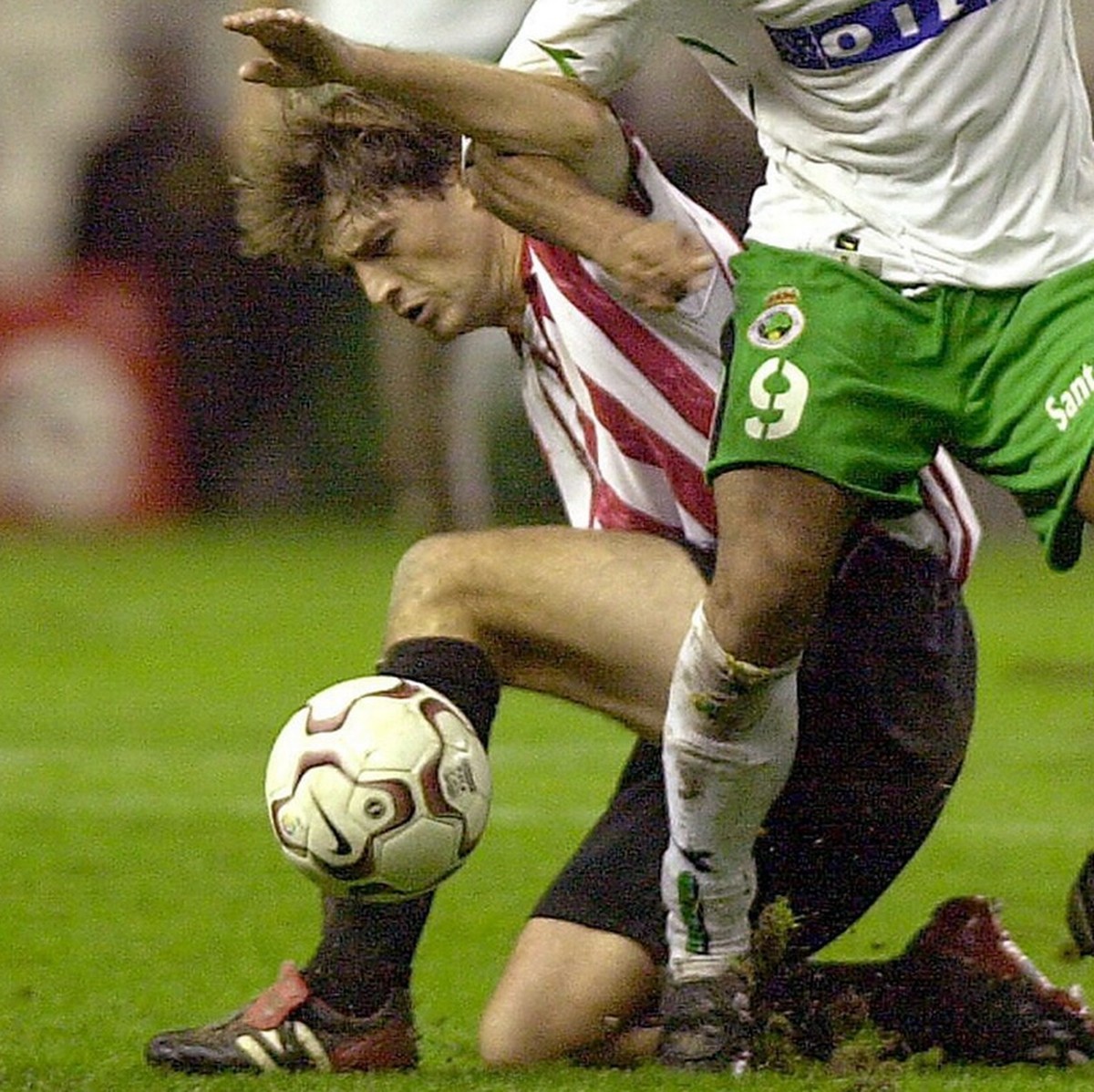 Athletic de Bilbao's Julen Guerrero (L), and Santander's Rodolfo Bodipo (R) challenge for the ball during their Spanish First Division soccer match on Sunday 30, November 2003 at the San Mam ...