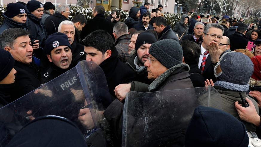 Riot police scuffle with protesters trying to march to the Turkish Parliament as the lawmakers gather to debate the proposed constitutional changes in Ankara, Turkey, January 9, 2017. REUTERS/Umit Bek ...