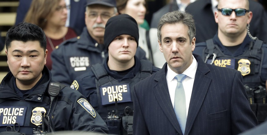 epa07226489 Michael Cohen (front -R), President Trump&#039;s former lawyer, departs United States Federal Court after being sentenced to three years in prison in New York, New York, USA, 12 December 2 ...