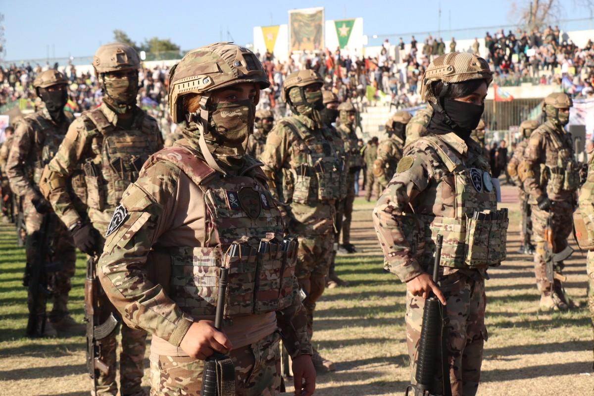 epa12296218 Soldiers affiliated with the Syrian Democratic Forces attend the funeral of senior Kurdistan Workers' Party (PKK) leader Nuredin Sofi in Qamishli, northeast Syria, 12 August 2025. The ...