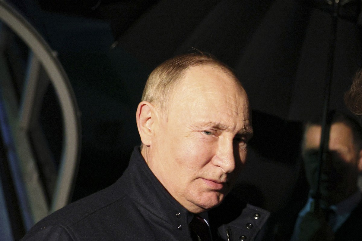 Russian President Vladimir Putin speaks to Oleg Kozhemyako, governor of the far eastern region of Primorsky Krai upon his arrival in Vladivostok, Russia Far east, Tuesday, Sept. 6, 2022. (Gavriil Grig ...