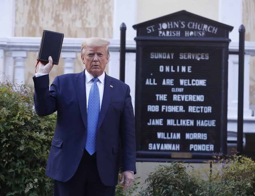 epa08939645 (FILE) US President Donald J. Trump poses with a bible outside St. John's Episcopal Church after delivering remarks in the Rose Garden at the White House in Washington, DC, USA, 01 Ju ...