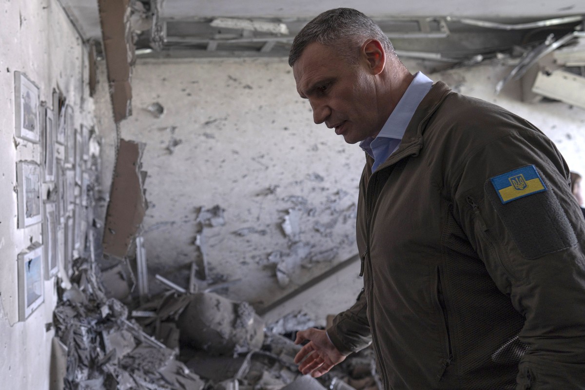 Kyiv Mayor Vitali Klitschko reacts standing in an apartment building damaged by a drone that was shot down during a Russian overnight strike, amid Russia's attack, in Kyiv, Ukraine, Monday, May 8 ...