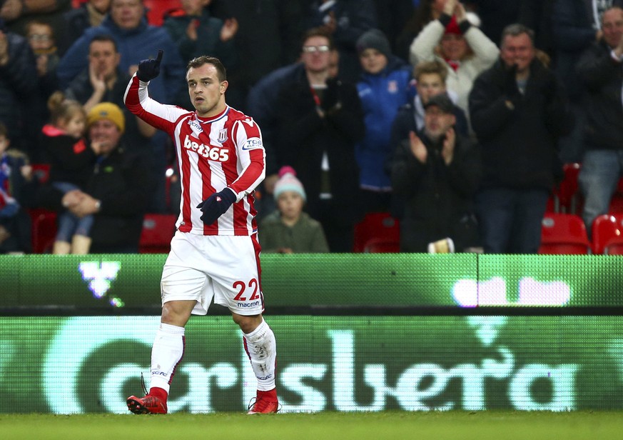 Stoke City&#039;s Xherdan Shaqiri celebrates scoring his side&#039;s first goal of the game against Swansea during the English Premier League soccer match at the Bet35 Stadium, Stoke, England, Saturda ...