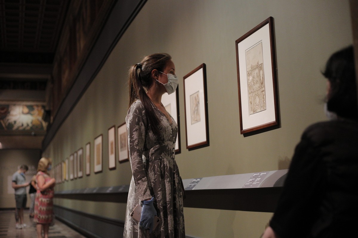 A visitors wearing a face mask to protect against coronavirus, looks at the exhibition "From Durer to Matisse Selected drawings" from the collection of the Pushkin State Museum of Fine Arts  ...