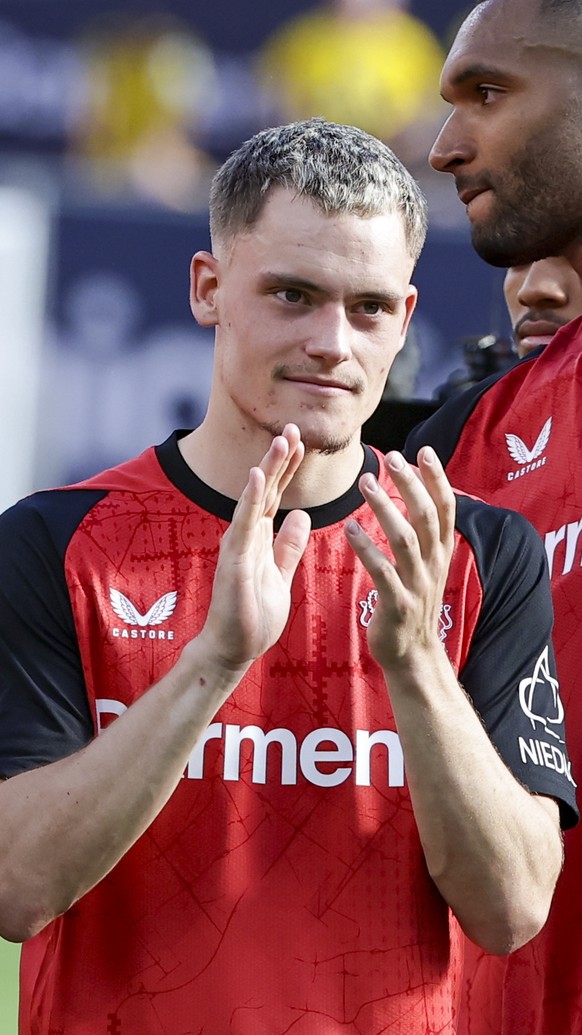 epa12091920 Florian Wirtz of Leverkusen reacts after the German Bundesliga soccer match between Bayer 04 Leverkusen and Borussia Dortmund in Leverkusen, Germany, 11 May 2025. EPA/CHRISTOPHER NEUNDORF  ...