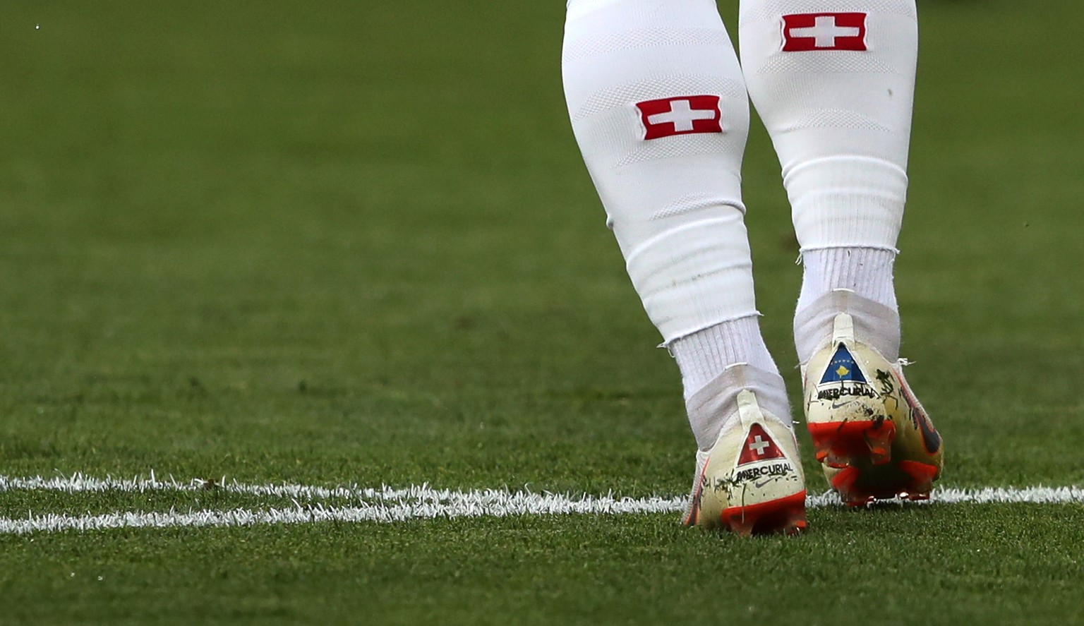 epa06831619 The shoes of Xherdan Shaqiri of Switzerland featuring the national flags of Switzerland (L) and Kosovo (R) prior to the FIFA World Cup 2018 group E preliminary round soccer match between S ...