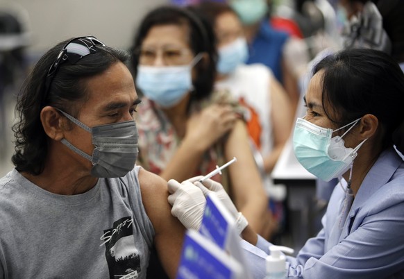 epa10596157 People receive a dose of vaccine booster against Covid-19 at a vaccination center in Bangkok, Thailand, 28 April 2023. Thai Public Health Ministry has revised its vaccination plan recommen ...