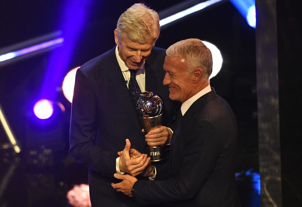 epa07044061 French national team head coach Didier Deschamps (R) receives from Former Arsenal London manager Arsene Wenger the Best FIFA Men's Coach award during the Best FIFA Football Awards 201 ...