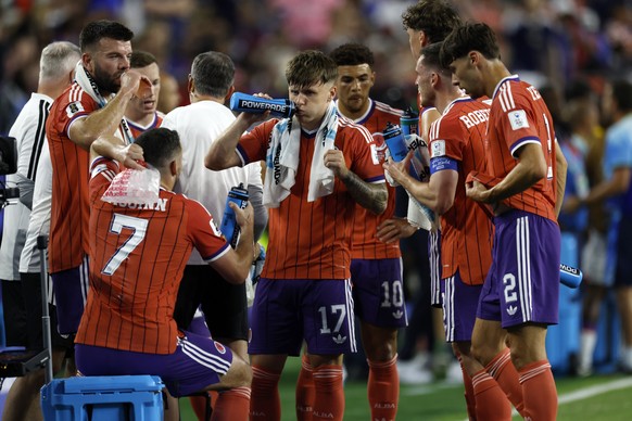 epa13035597 Players of Scotland gather for the hydration break during the FIFA World Cup 2026 group stage match Haiti against Scotland, in Foxborough, Massachusetts, USA, 13 June 2026. EPA/GREG M. COO ...