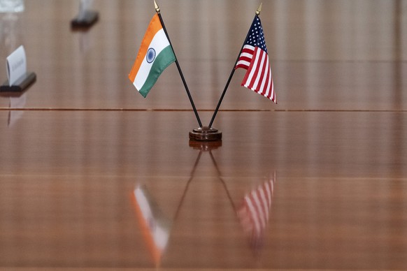 FILE- The countries&#039; flags are seen on the table during a meeting with India&#039;s Foreign Minister Subrahmanyam Jaishankar and U.S. Secretary of Defense Lloyd Austin at the Pentagon, Monday, Se ...