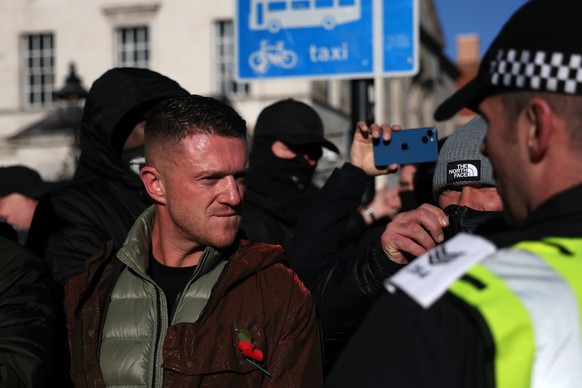 epa10969760 Far-right activist Tommy Robinson looks on as the police block the access to the Cenotaph where the Armistice Day service was taking place in London, Britain, 11 November 2023. Clashes hav ...