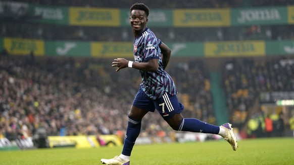 Arsenal&#039;s Bukayo Saka celebrates scoring during the English Premier League soccer match between Norwich City and Arsenal at Carrow Stadium, Norwich, England, Sunday Dec. 26, 2021. (Joe Giddens/PA ...