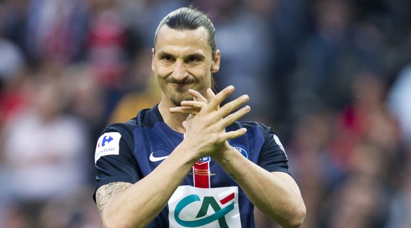 Paris Saint Germain&#039;s Zlatan Ibrahimovic reacts after his team missed to score a goal during the French Cup final soccer match against Auxerre at the Stade de France Stadium, in Saint Denis, nort ...