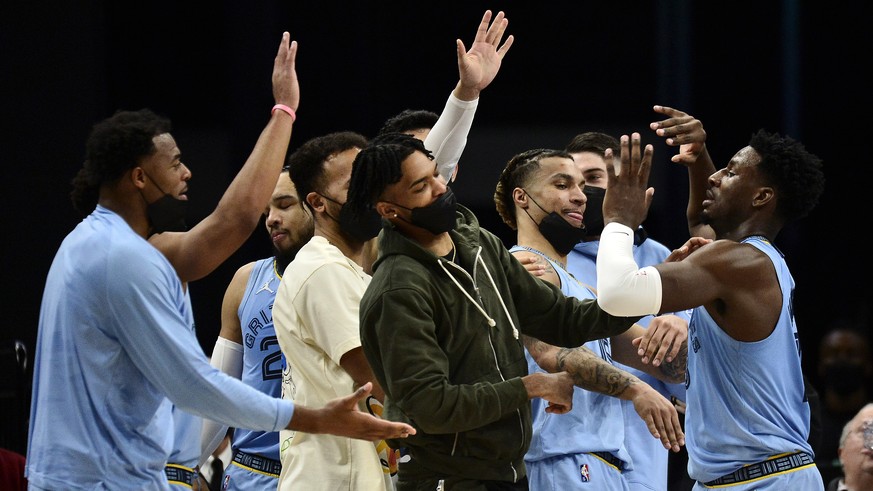 Memphis Grizzlies forward Jaren Jackson Jr., right, greets teammates in the first half of an NBA basketball game against the Oklahoma City Thunder, Thursday, Dec. 2, 2021, in Memphis, Tenn. (AP Photo/ ...