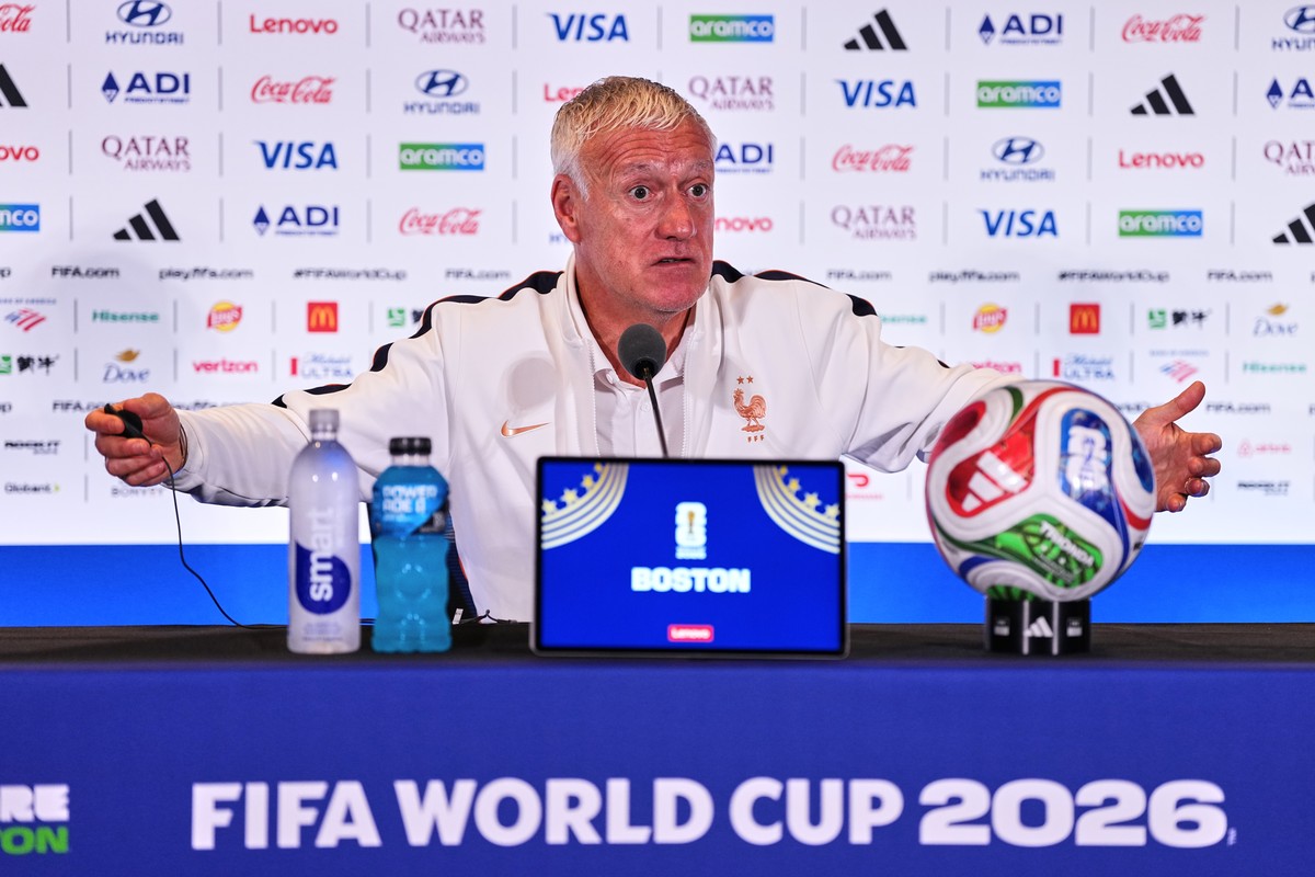 France head coach Didier Deschamps talks to the media at a press conference ahead of the World Cup quarterfinal soccer match between France and Morocco in Foxborough, Mass., near Boston, Wednesday, Ju ...