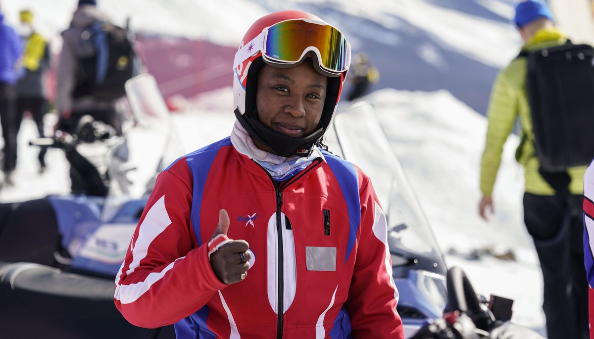 Celine Marti of Haiti thumbs up at the finish line after the first run of a women's giant slalom, at the alpine ski World Championships, in Cortina d'Ampezzo, Italy, Thursday, Feb. 18, 2021. ...