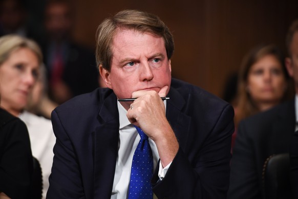 epa07052943 White House Counsel and Assistant to the President for US President Donald Trump, Donald McGahn, listens to Supreme Court nominee Brett Kavanaugh (unseen) as he testifies before the Senate ...
