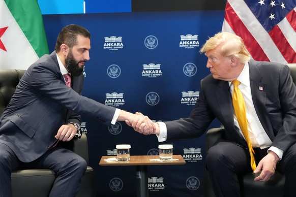 U.S. President Donald Trump meets with Syrian President Ahmad al-Sharaa on the sidelines of the NATO summit in Ankara, Turkey, Wednesday, July 8, 2026. (AP Photo/Alex Brandon)
Donald Trump,Ahmad al-Sh ...