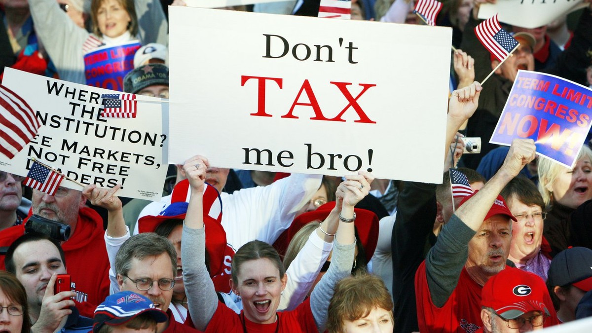 A woman holds a sign that reads "Don't tax me bro! " during the Atlanta Tea Party tax protest Wednesday, April 15, 2009 in Atlanta. Thousands of protesters, some dressed like Revolution ...