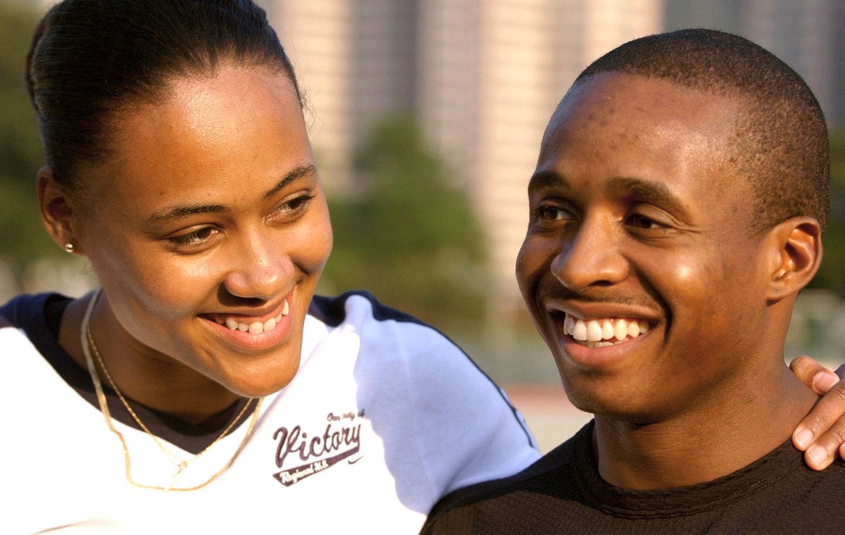 Three-time Olympic gold medalist Marion Jones, left, and her boyfriend Tim Montgomery, current world record holder for 100 meters, pose for photographers during TAG Heuer's watch promotion in Hon ...