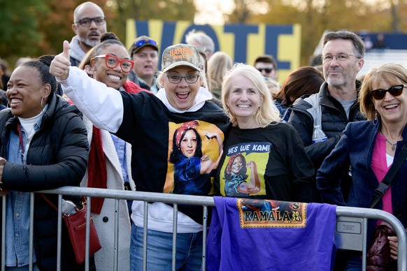 epa11689588 Rally goers for US Vice President and Democratic presidential nominee Kamala Harris, display their t-shirts at her campaign rally at Burns Park in Ann Arbor, Michigan, USA, 28 October 2024 ...