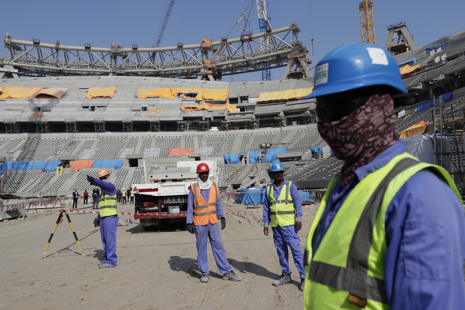 Workers work at Lusail Stadium, one of the 2022 World Cup stadiums, in Lusail, Qatar, Friday, Dec. 20, 2019. Construction is underway to complete Lusail&#039;s 80,000-seat venue for the opening game a ...