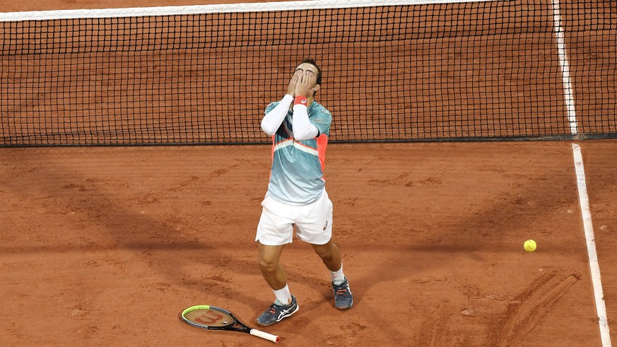 epa08716054 Hugo Gaston of France celebrates after winning his third round match against Stan Wawrinka of Switzerland at the French Open tennis tournament at Roland Garros in Paris, France, 02 October ...