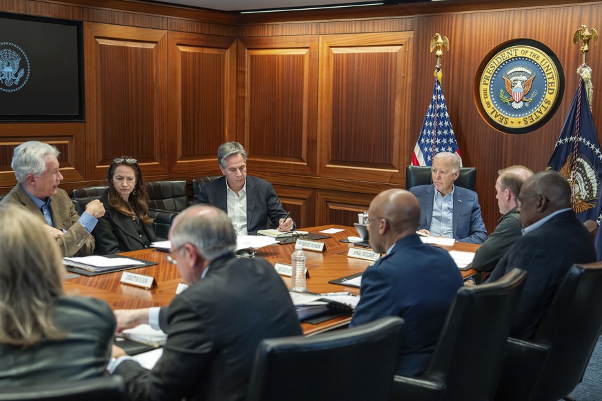 In this image released by the White House, President Joe Biden, along with members of his national security team, receive an update on an ongoing airborne attack on Israel from Iran, as they meet in t ...