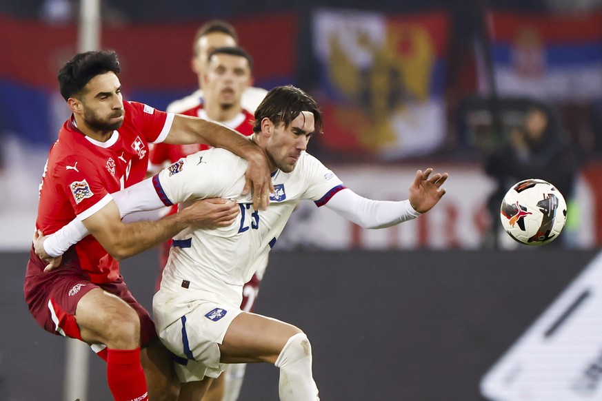 Switzerland&#039;s Eray Comert, left, and Serbia&#039;s Dusan Vlahovic in action during the UEFA Nations League soccer match between Switzerland and Serbia at the Letzigrund stadium in Zurich, Switzer ...