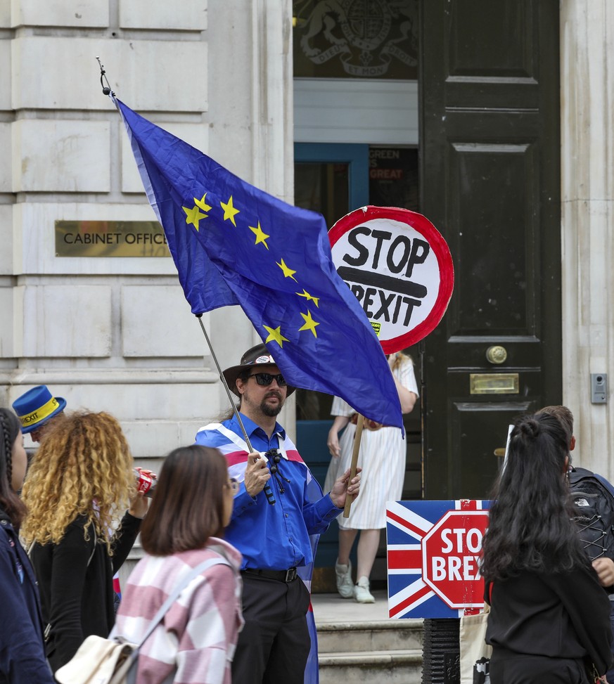 Anti-Brexit protesters demonstrate outside the Cabinet Office in Whitehall in London on Thursday, Aug. 15, 2019. Demonstrations for both sides of the Brexit debate continue around parliament, as Prime ...