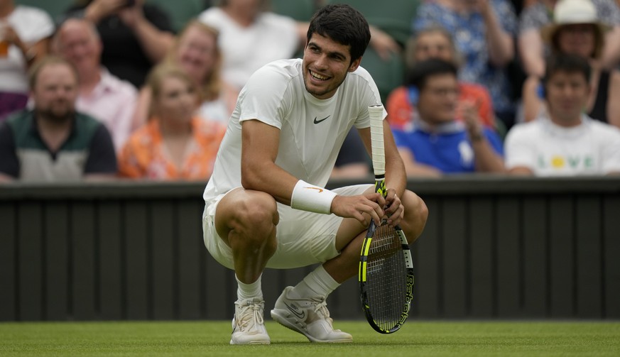 Spain&#039;s Carlos Alcaraz smiles as he plays Chile&#039;s Nicolas Jarry in a men&#039;s singles match on day six of the Wimbledon tennis championships in London, Saturday, July 8, 2023. (AP Photo/Al ...
