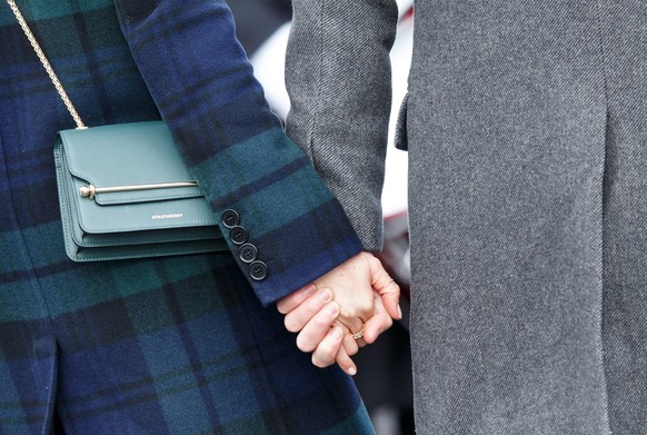 epa06521765 Britain&#039;s Prince Harry (R) and his fiancee Meghan Markle (L) hold their hands during a visit to Edinburgh Castle, in Edinburgh, Britain, on their first official joint visit to Scotlan ...