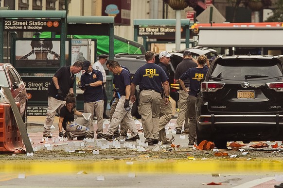 FILE - In this Sunday, Sept. 18, 2016 file photo, members of the Federal Bureau of Investigation (FBI) carry on investigations at the scene of Saturday&#039;s explosion on West 23rd Street and Sixth A ...
